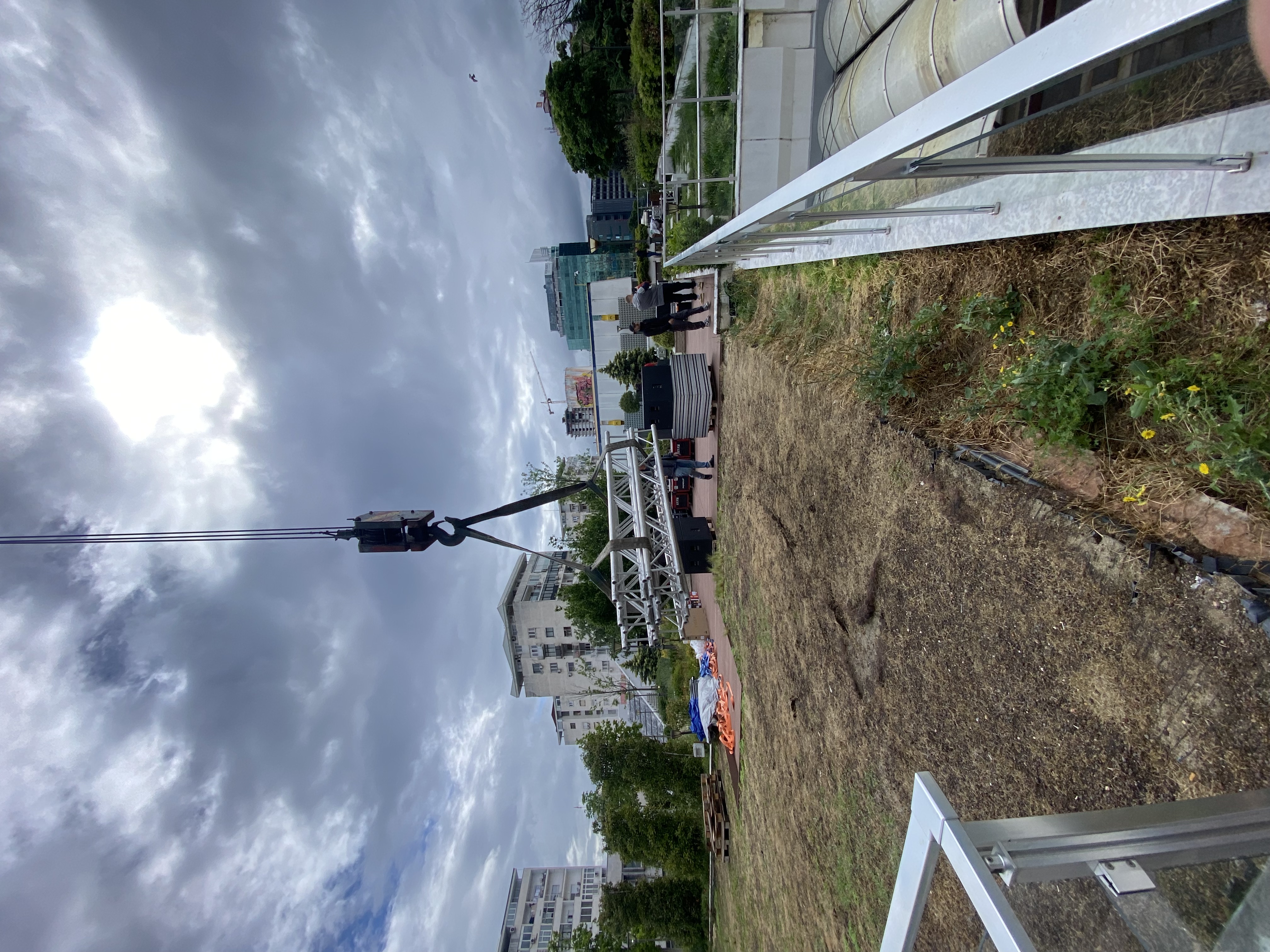 Truss delivery by crane for a rooftop event installation