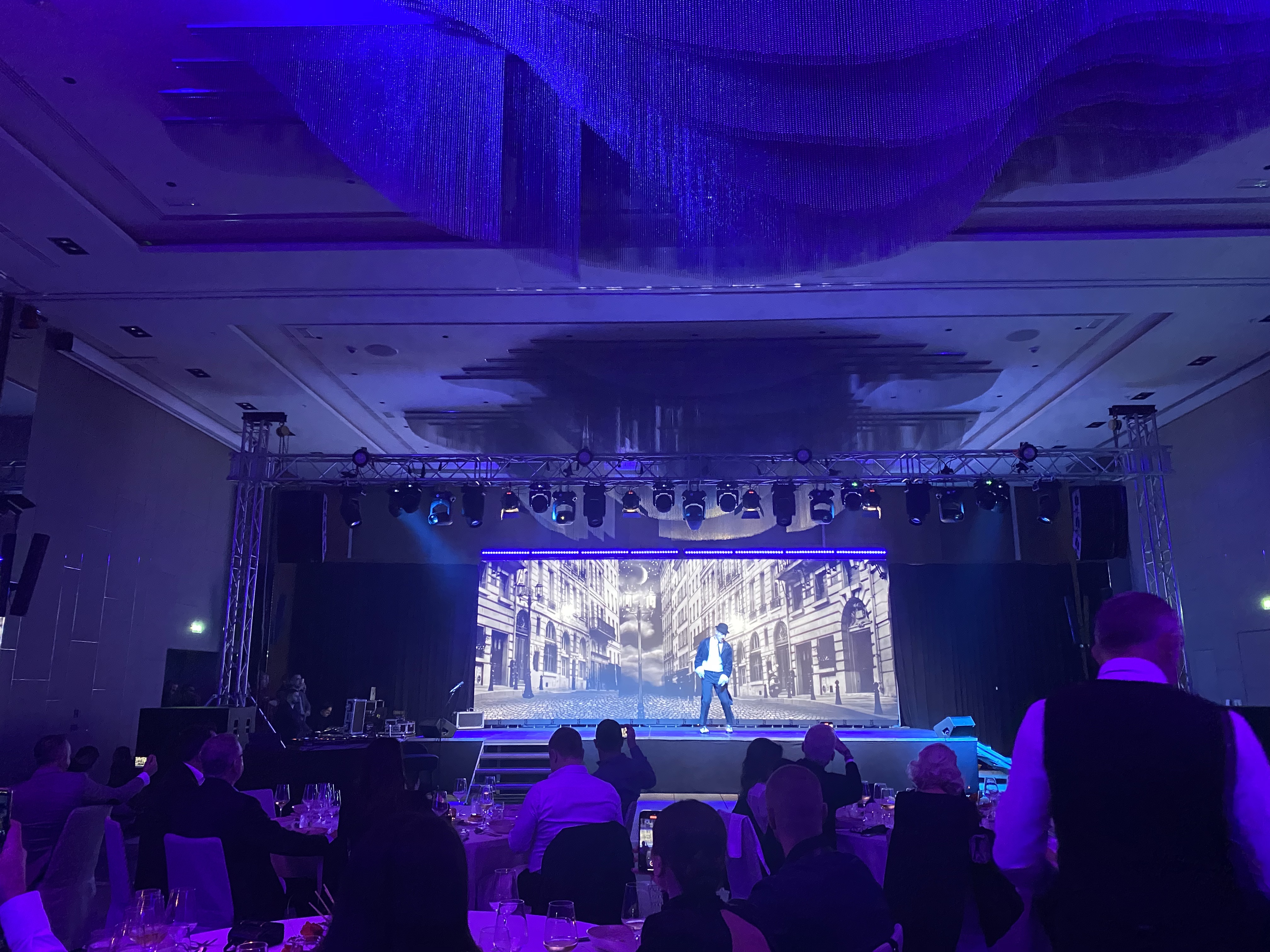 Banquet hall production with LED wall and atmospheric lighting
