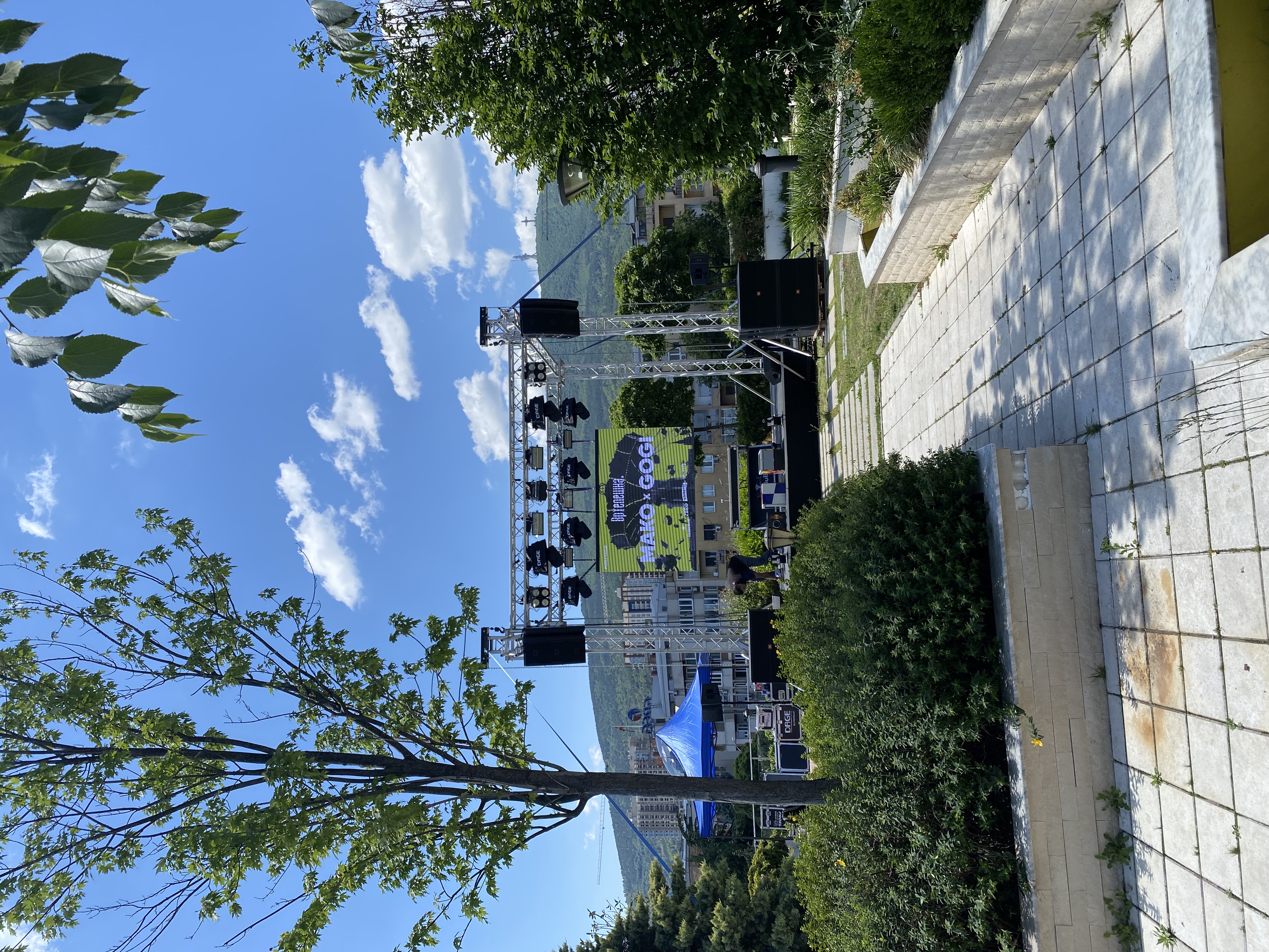 Hillside stage rig with full truss package overlooking Skopje